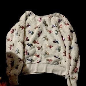 This is white and it has rainbow unicorn on it